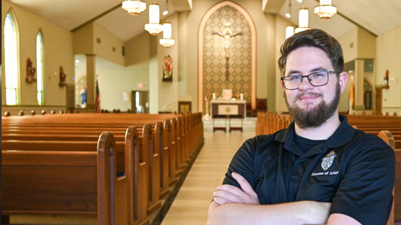 Portrait of Seminarian Matthew Bernhard standing in an empty church